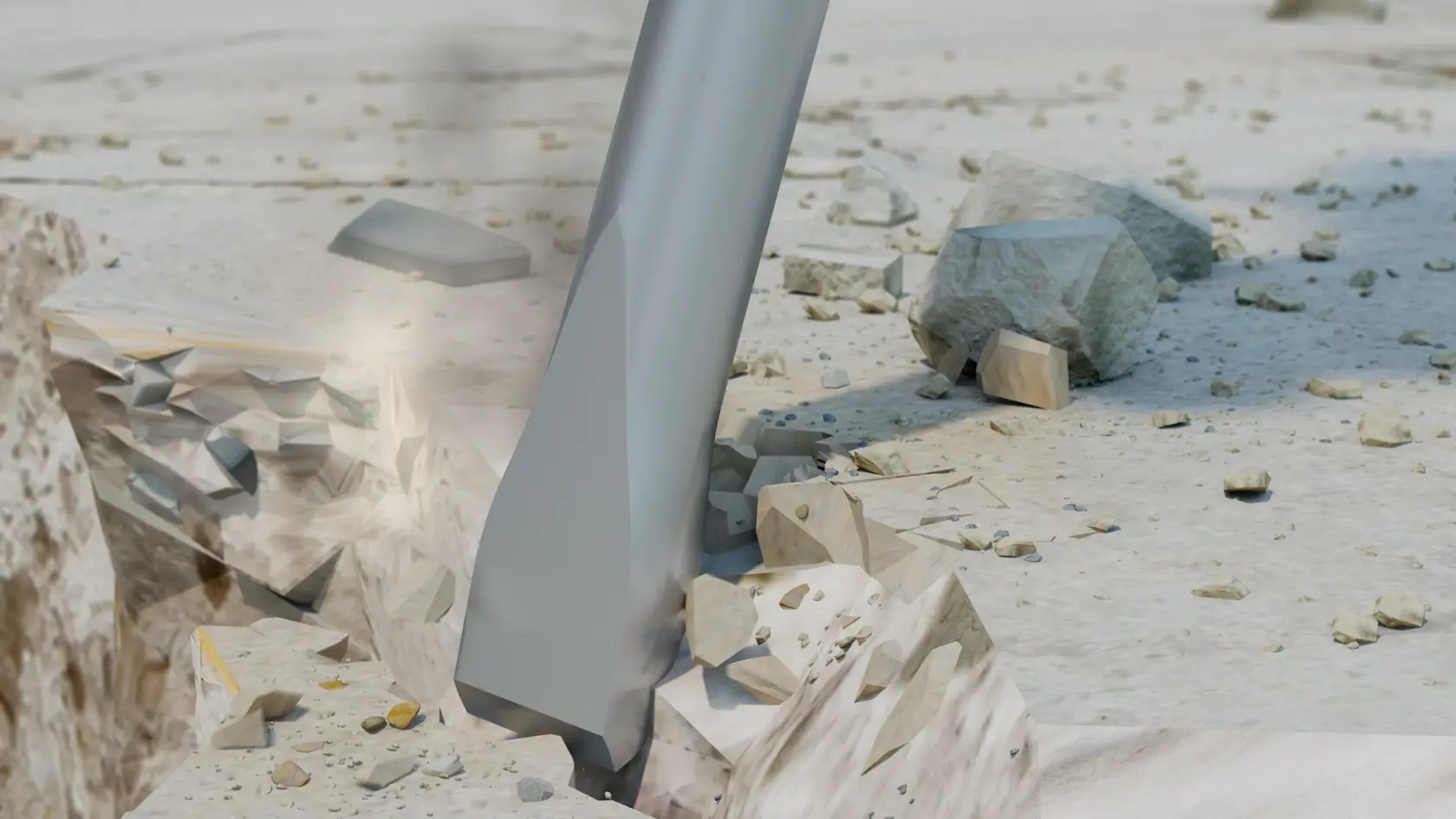 Gros plan sur un burin d'outil de démolition brisant du béton, avec des débris et des pierres éparpillés autour de la zone d'impact.