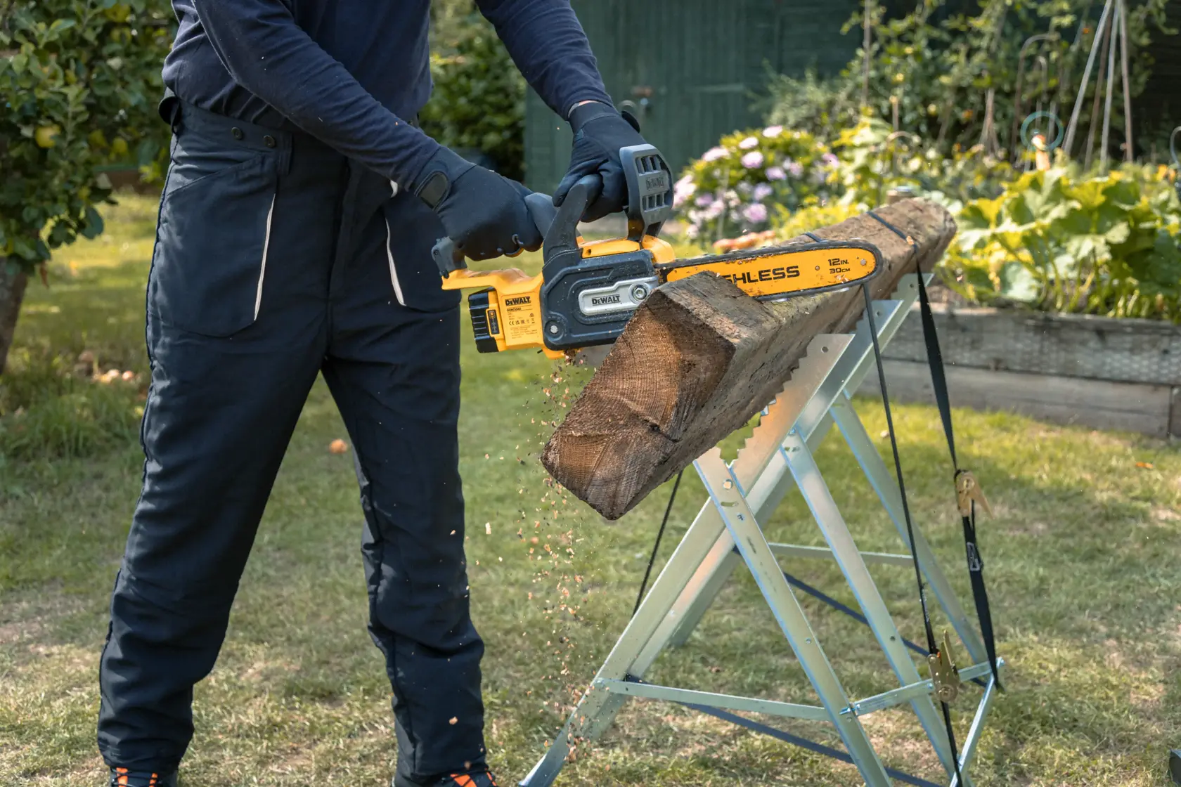 DEWALT chainsaw in use outdoors, SKUs DCMCS565P1-QW, DCMCS565N, DCMCS565P1, DCMCS565N-XJ shown cutting wood.