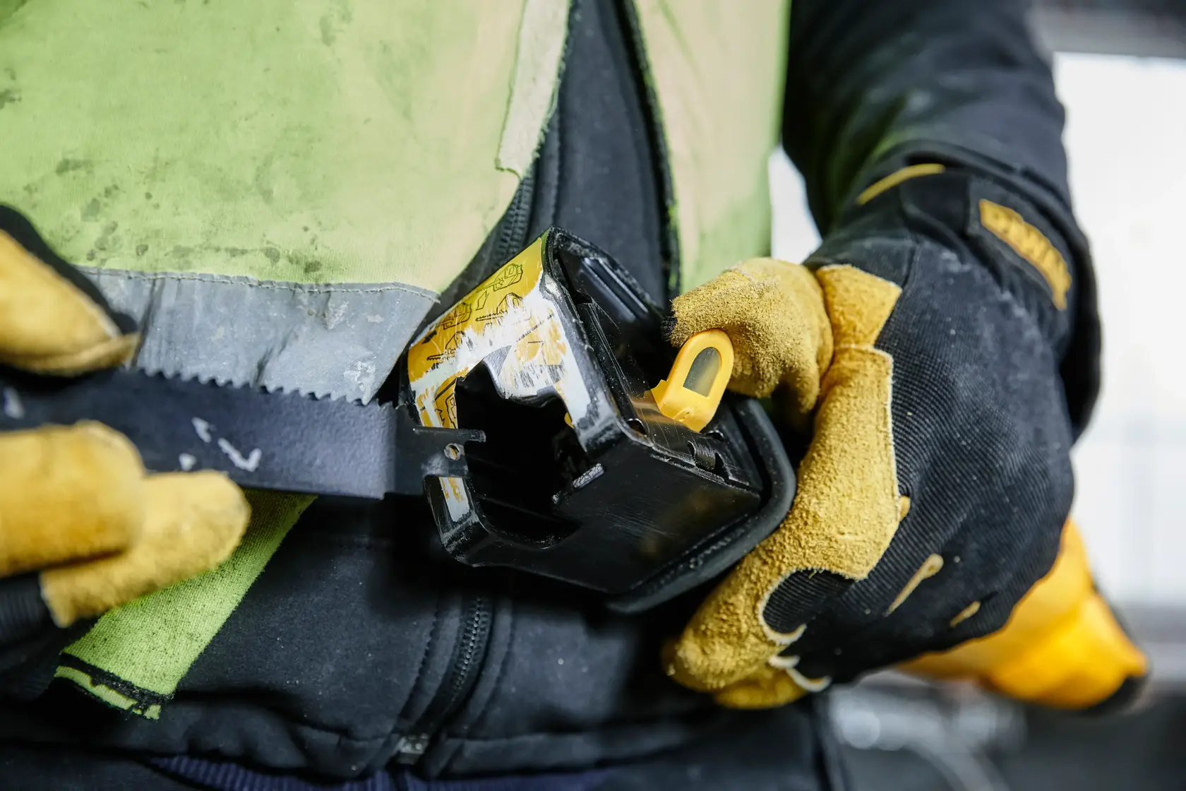A DEWALT reciprocating saw with a yellow and black design, shown against a white background. Below the saw, a text reads: 'Ideal for plumbers, electricians, & builders.'